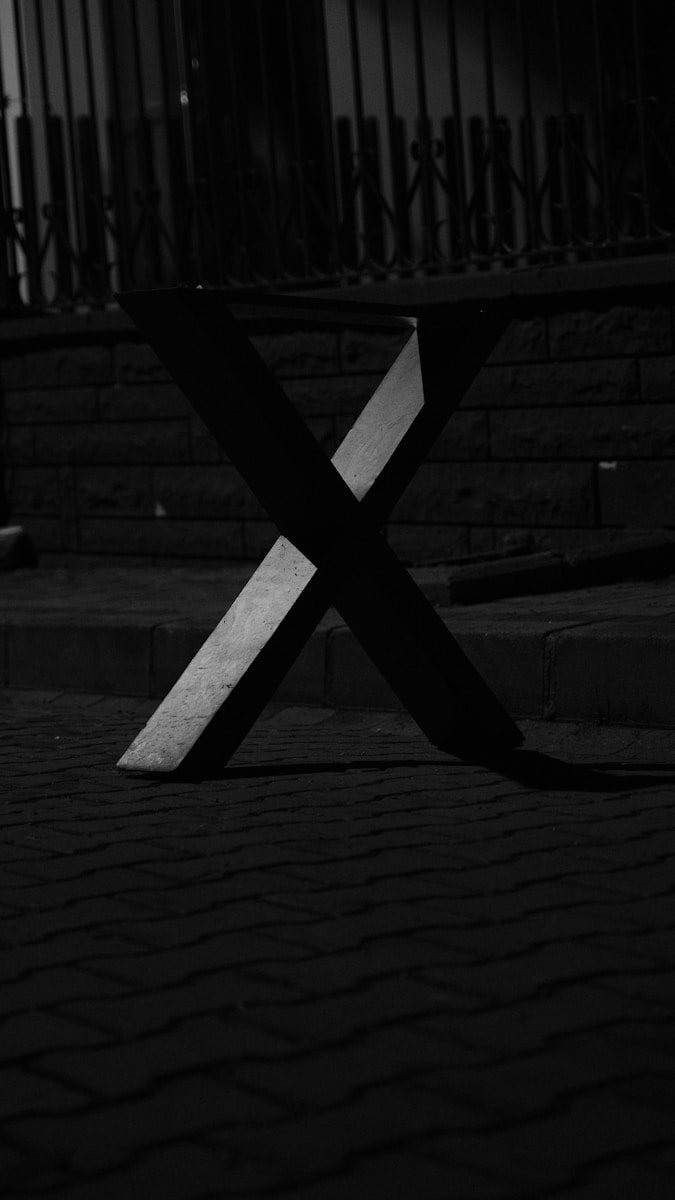 A black and white photo of a bench
